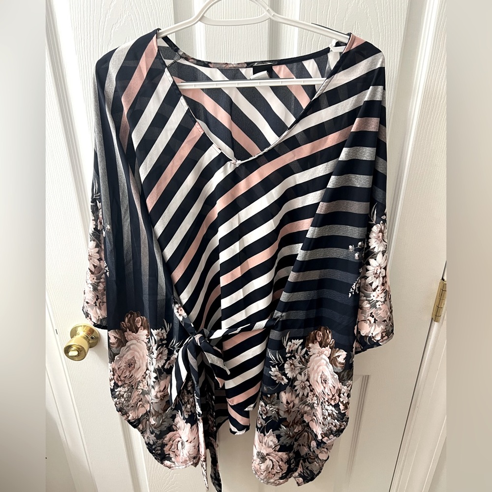Lilian boutique shirt. One size with tie string that ties around back and waist.